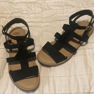 Black strappy sandals with tassels